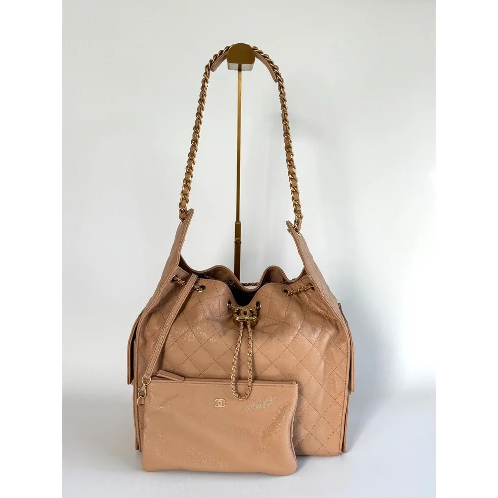 Chanel 25 Quilted Caviar Leather Beige Gold Hardware Drawstring CC, medium siz